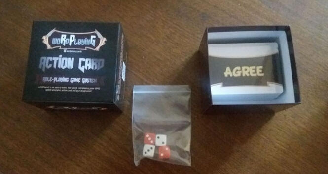 Open woRdPlayinG box with dice removed showing cards.